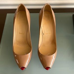 Christian Louboutin’s. Tan patent leather open toed pumps.